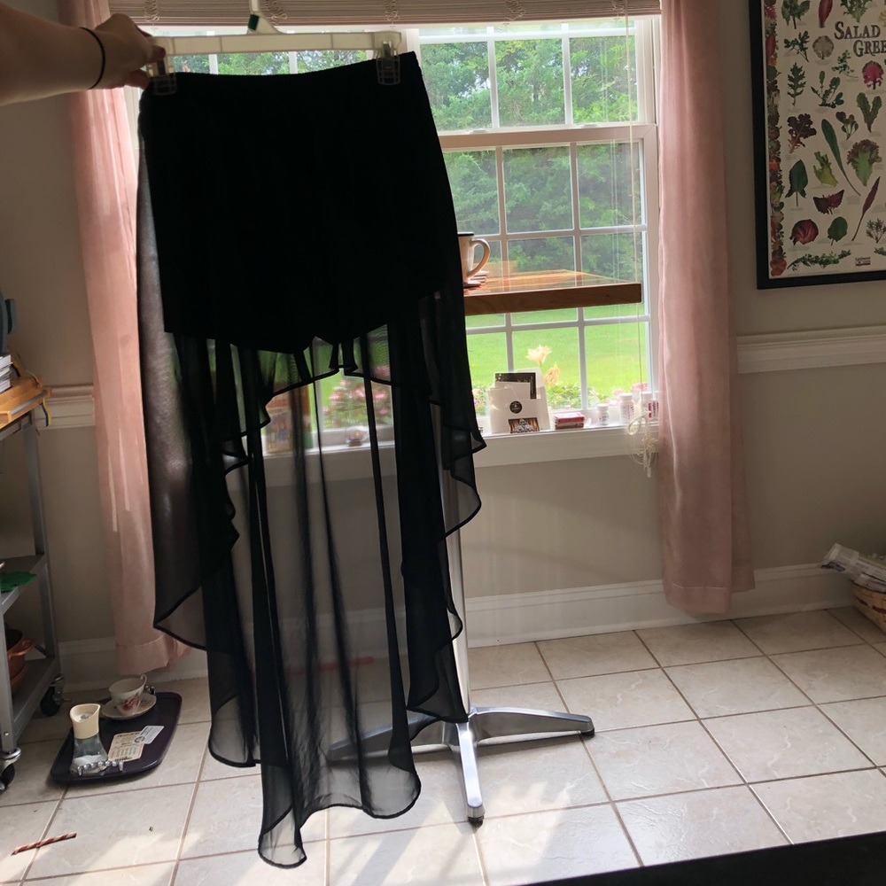 Black shorts with back sheer low high over skirt
